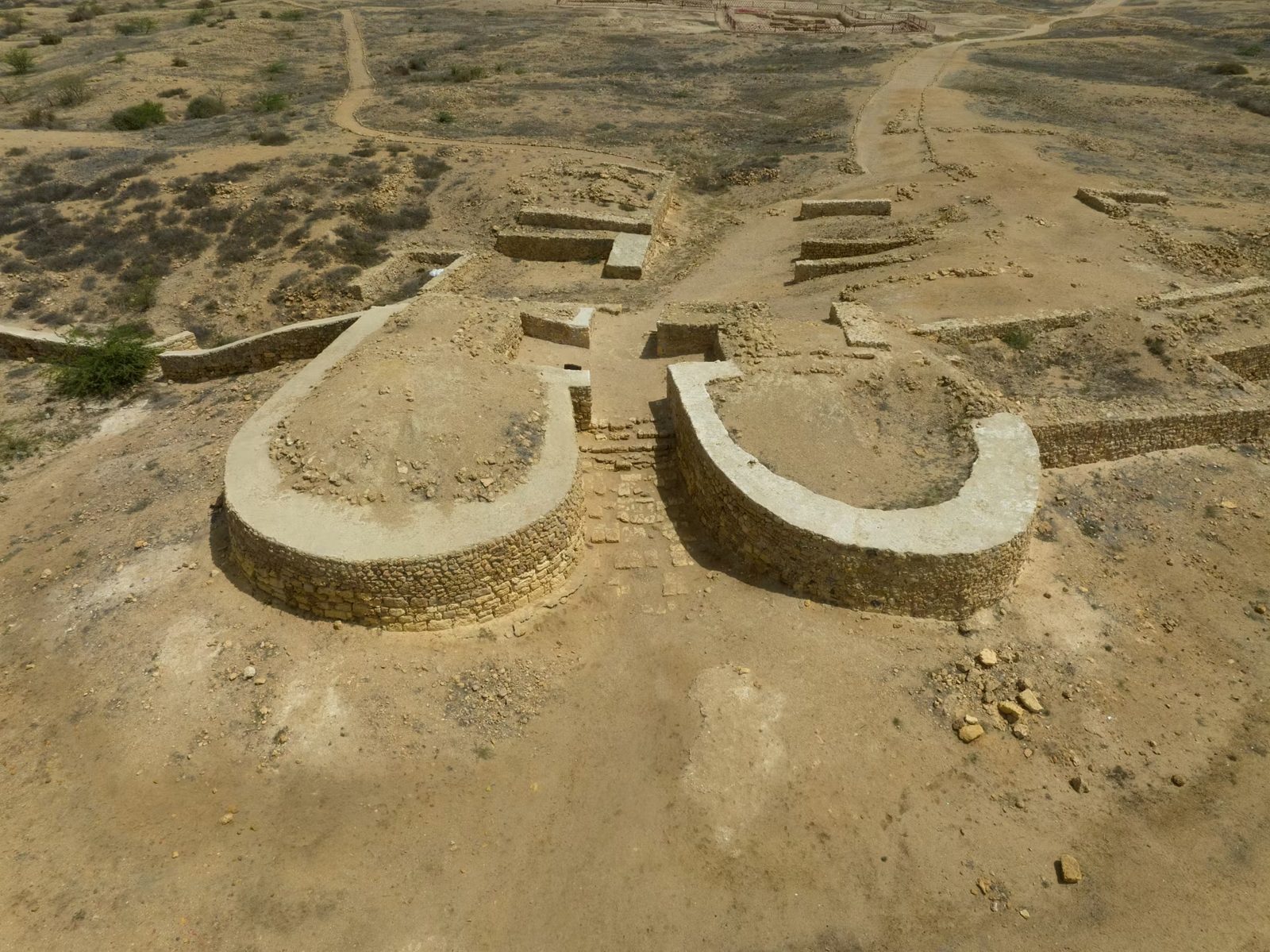 Aerial view of the southern gate of Banbhore with semi-circular bastions overlooking the Gharo creek