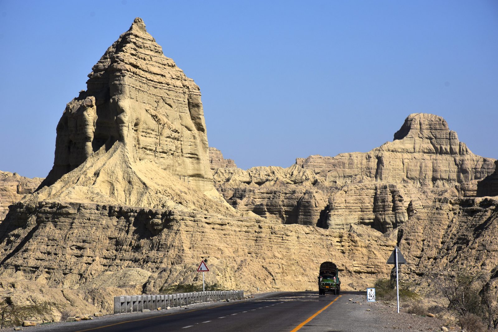 Wind-carved mud pinnacles rising beside the Makran Coastal Highway in Hingol National Park